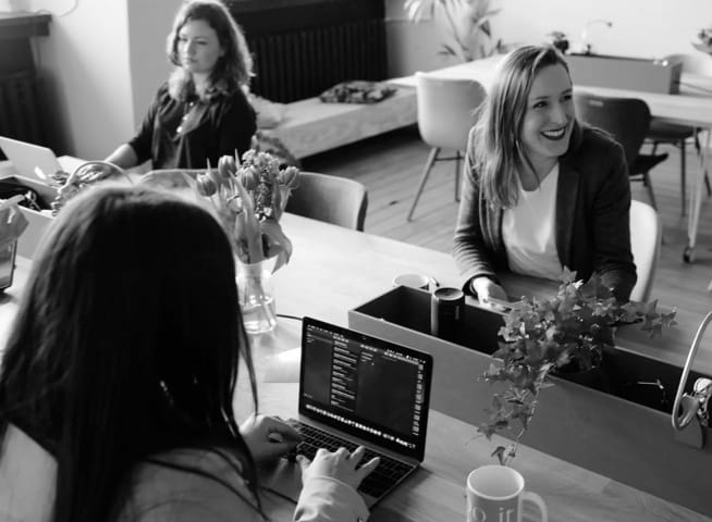 people working at a desk